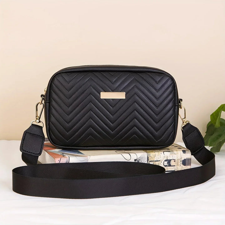 Elegante Damen Handtasche aus schwarzem Kunstleder mit verstellbarem Gurt, ideal für den Alltag.