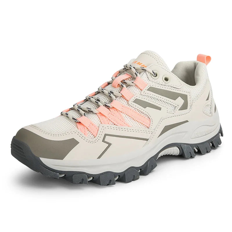 Atmungsaktive rosa-weiße Damen Trekking Schuhe, ideal für Wanderungen und sportliche Aktivitäten.