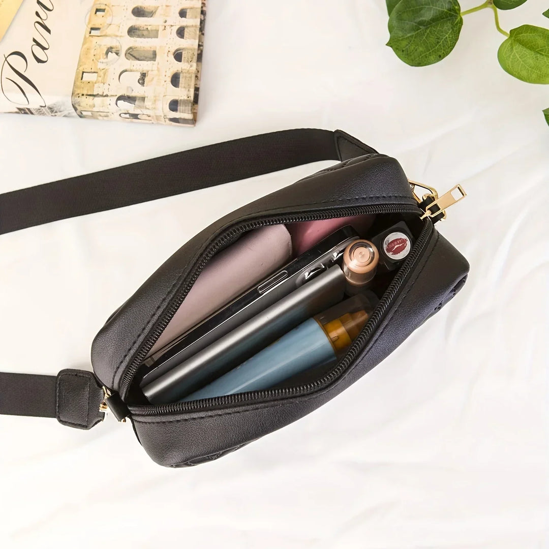 Vielseitige Damen Handtasche aus strapazierfähigem PU-Kunstleder, schwarz, mit flexiblem Schultergurt.