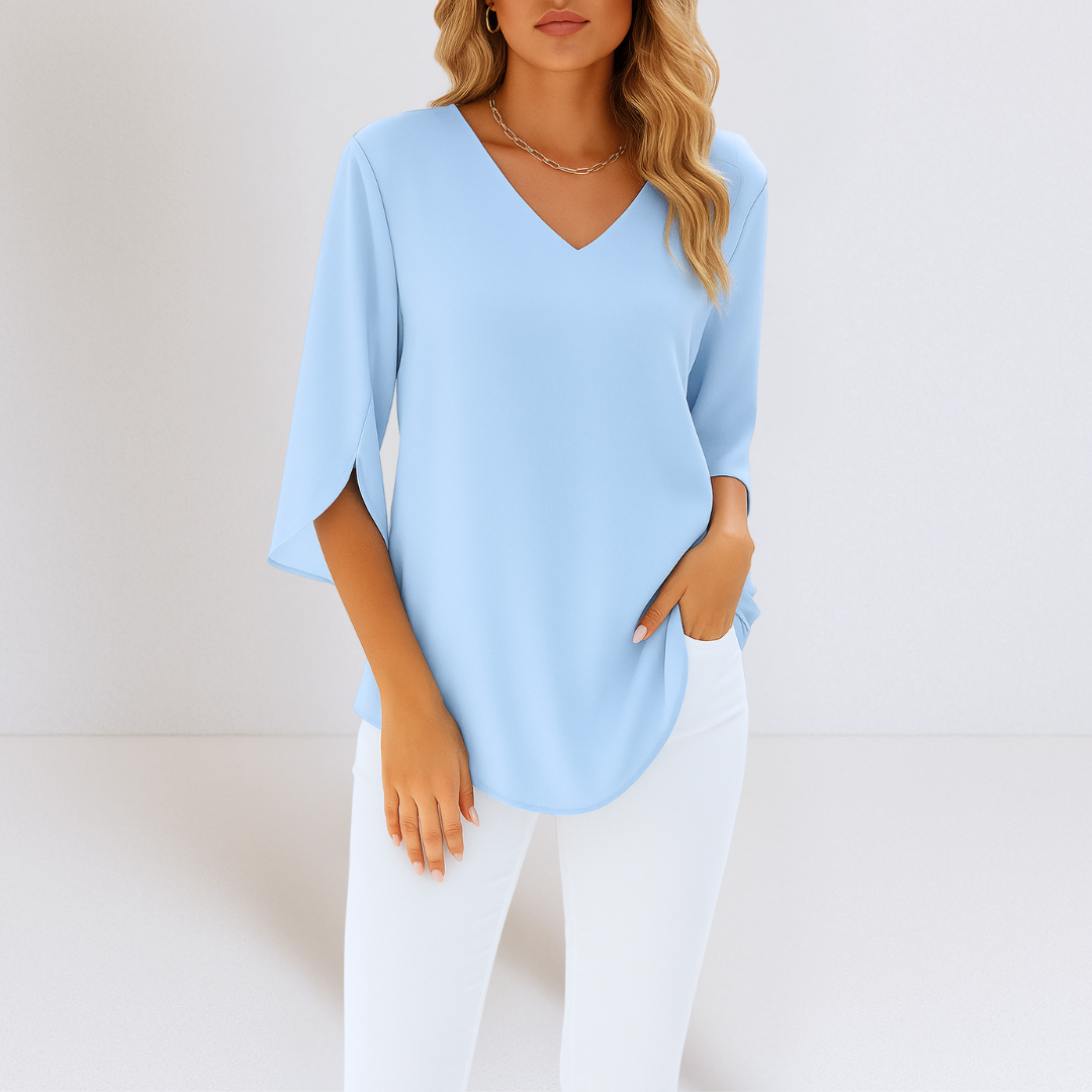 Elegante Damen Bluse mit V-Ausschnitt und geschlitzten Ärmeln in Weiß. Perfekt für sommerliche, luftige Freizeitlooks.