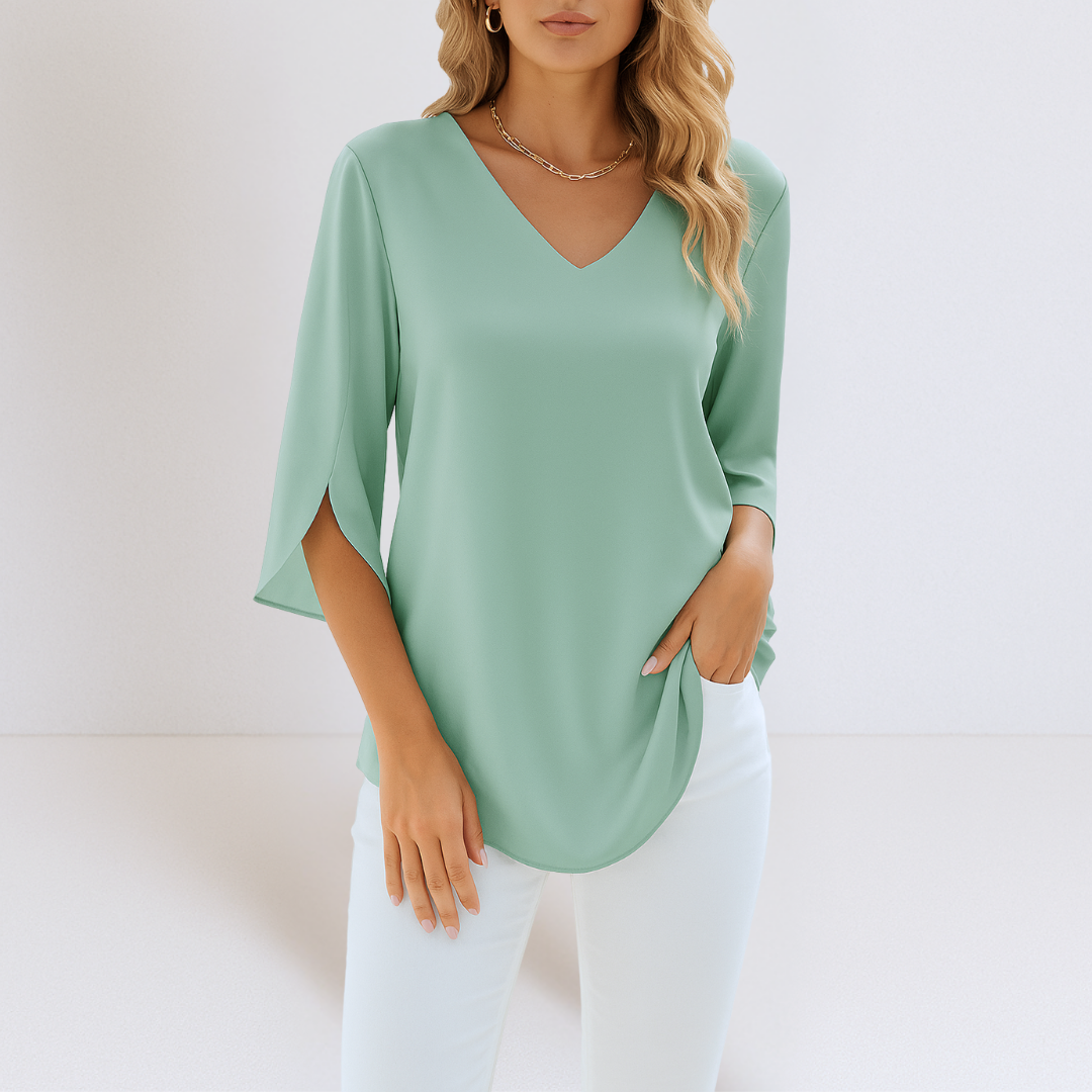 Locker geschnittene Damen Bluse in Rosa mit V-Ausschnitt & geschlitzten Ärmeln. Ideal für einen luftigen Sommer-Look.