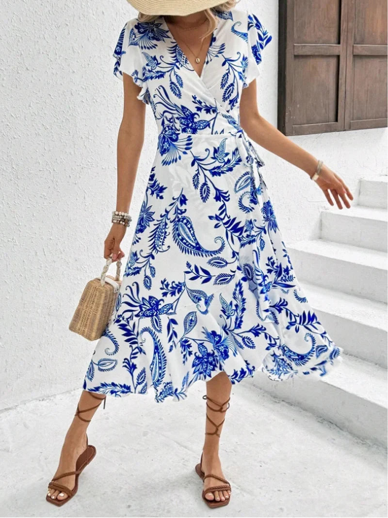 Stilvolles Damenkleid mit Blumenprint, Midilänge, fließender Schnitt & leichtes Material für Eleganz.