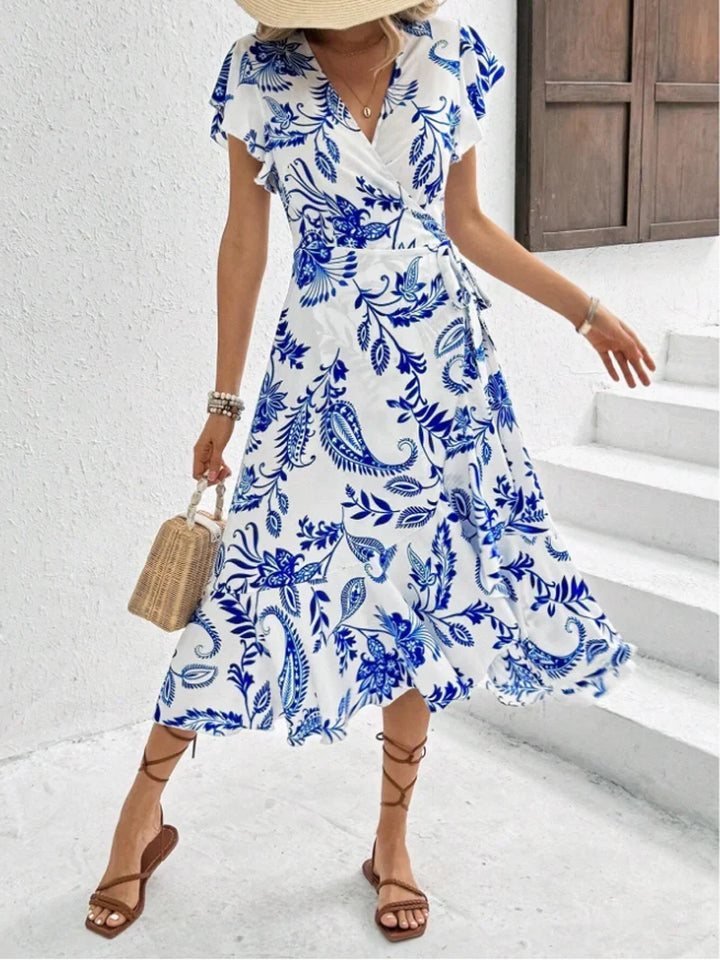 Stilvolles Damenkleid mit Blumenprint, Midilänge, fließender Schnitt & leichtes Material für Eleganz.