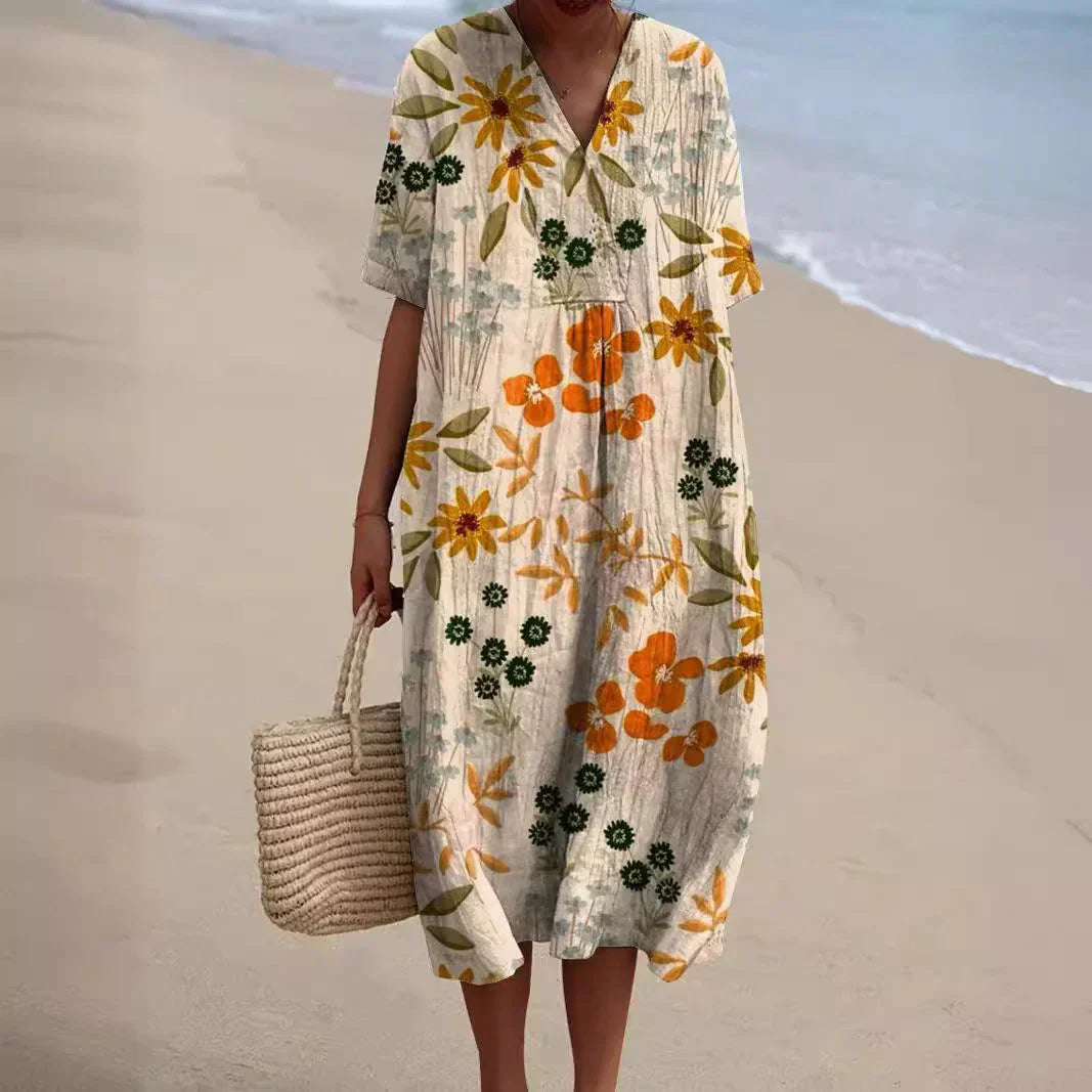 Damen Bohème Blumen Midikleid mit V-Ausschnitt. Fließend & elegant, ideal als Sommer-Freizeitkleid.