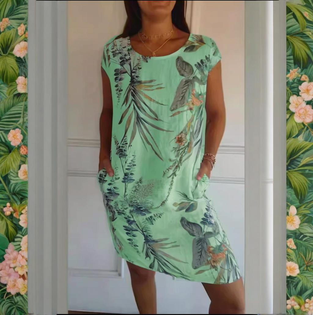 Stilvolles Damen Sommerkleid in leichtem Stoff, mit Blumenprint, Rundhals und diskreten Seitentaschen.