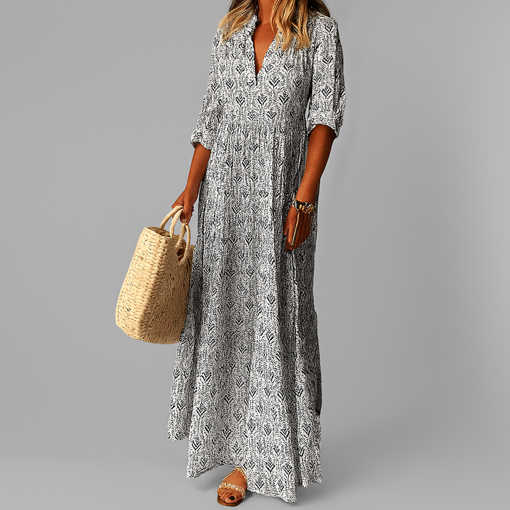 Elegantes Damen Maxikleid in Blau mit floralem Print, fließender A-Linie. Perfekt für Sommer und Urlaub.