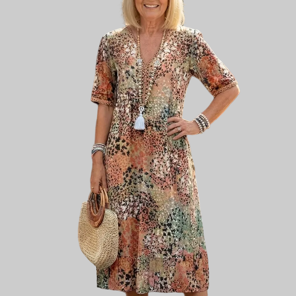 Bedrucktes Damen Midi-Kleid mit lockerer Passform, ideal als stilvolles Alltagskleid oder Sommerkleid mit V-Ausschnitt.
