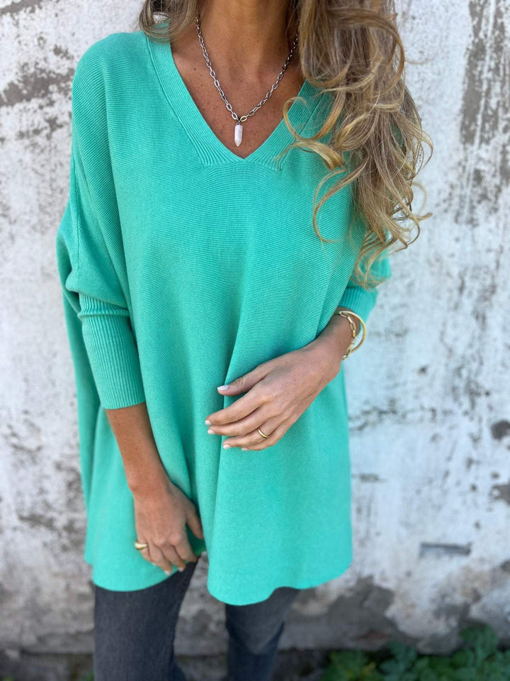 Damen Mode Langarm Pullover mit V-Ausschnitt, bequem geschnitten, ein vielseitiges Oberteil.