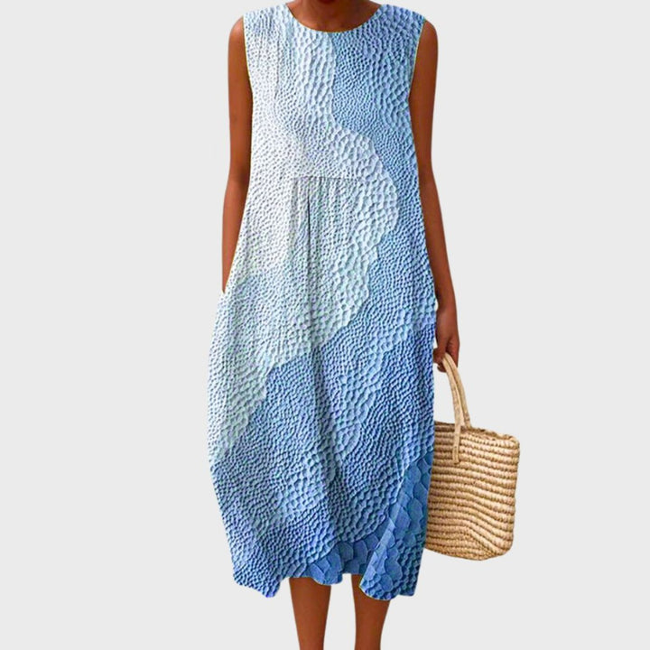 Elegantes blaues Damen Midikleid, ärmelloses Sommerkleid mit fließendem Stufenrock. Ideal für warme Tage & Urlaub.
