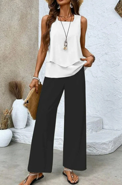 Modell trägt eleganten Damen Sommer-Zweiteiler: ärmelloses Top & weite Hose für einen luftigen Auftritt.