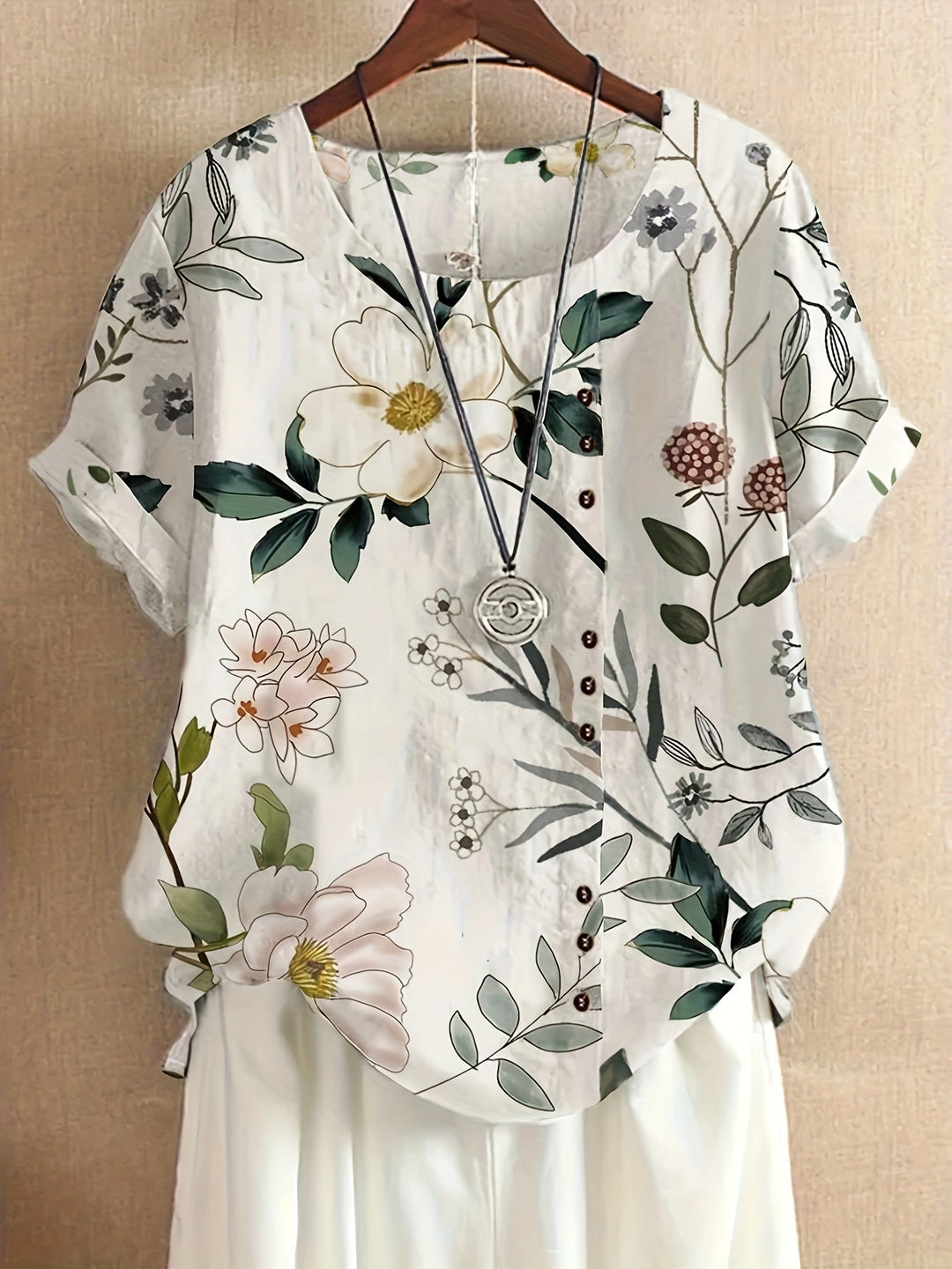 Damen Vintage Bluse mit farbigem Blumenmuster, Kurzarm, Rundhalsausschnitt, perfekt für den Sommer.