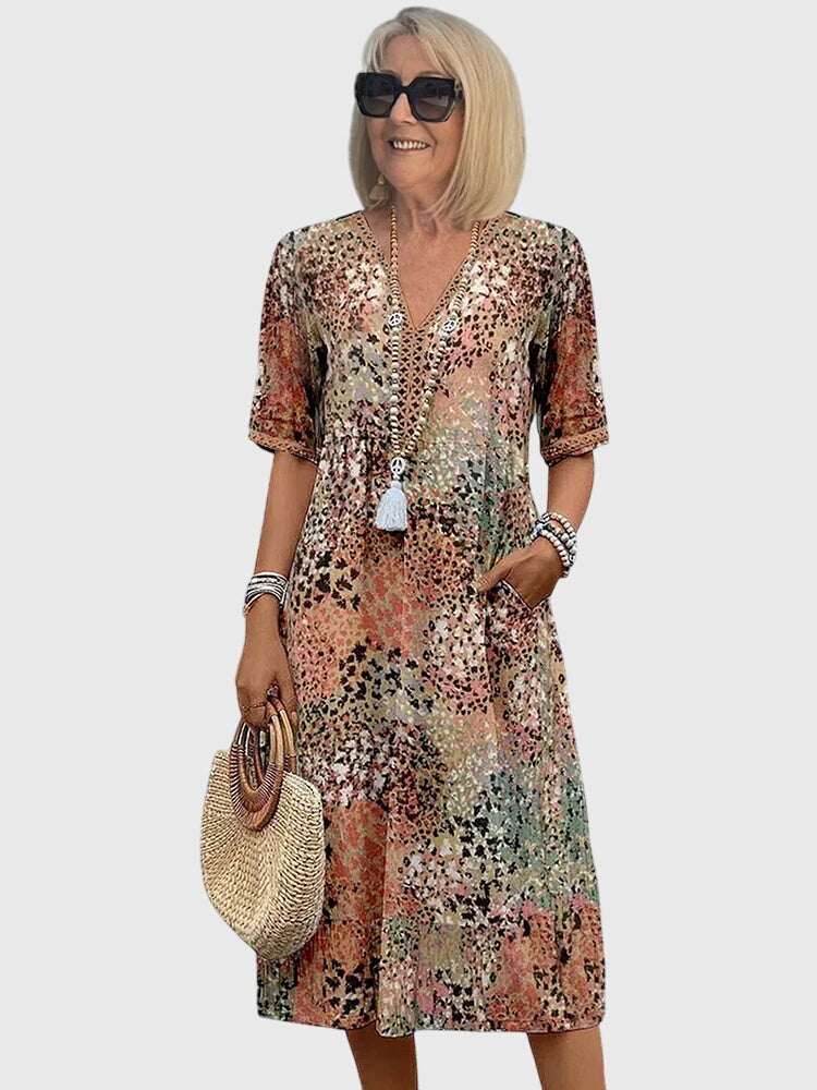 Elegantes Damen Midikleid mit Blumenmuster, figurschmeichelnd, perfekt für Sommer & festliche Anlässe.