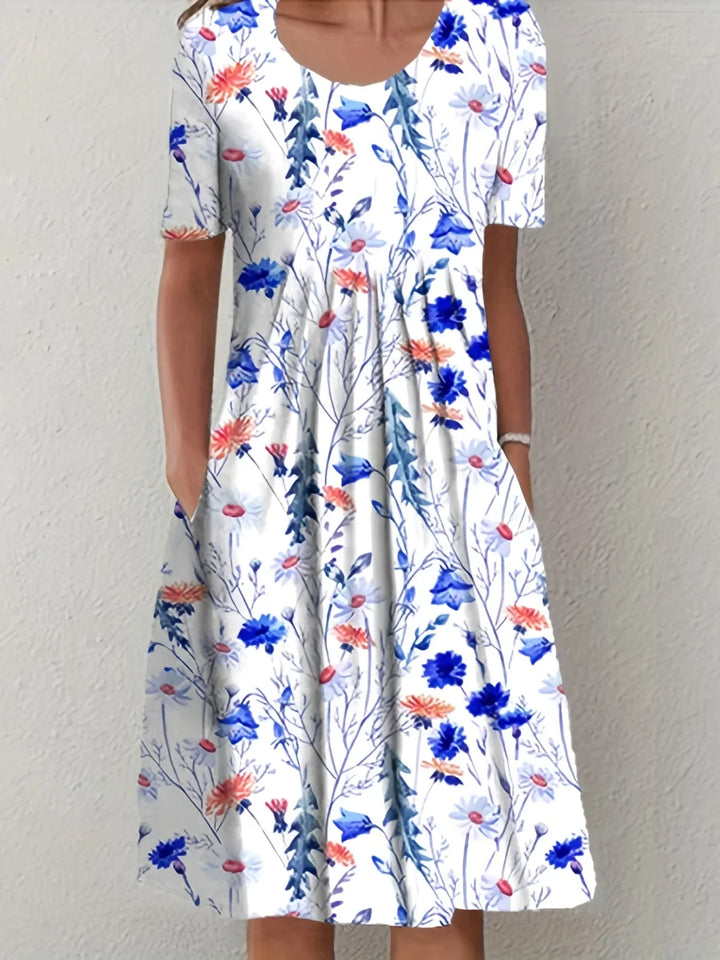 Fließendes Damen Sommer Blumenkleid mit kurzen Ärmeln. Ideal für festliche Anlässe, bequem und modisch.