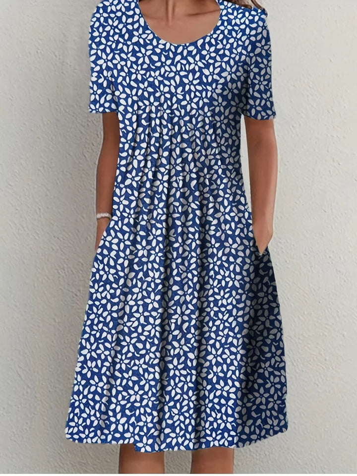 Stilvolles Damen Blumen Freizeitkleid mit kurzen Ärmeln. Bequem und ideal für Frühling & Sommer-Events.