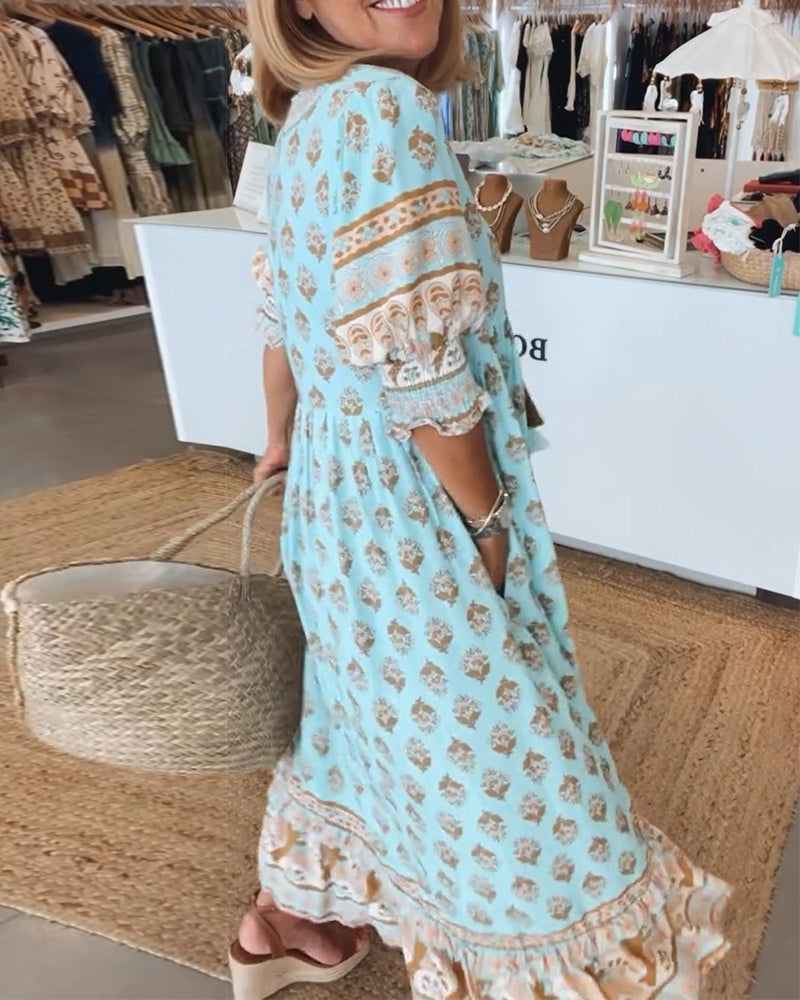 Elegantes Damen Boho-Midikleid mit V-Ausschnitt und auffälligem Medallion-Print, perfekt für Strand & Freizeit.