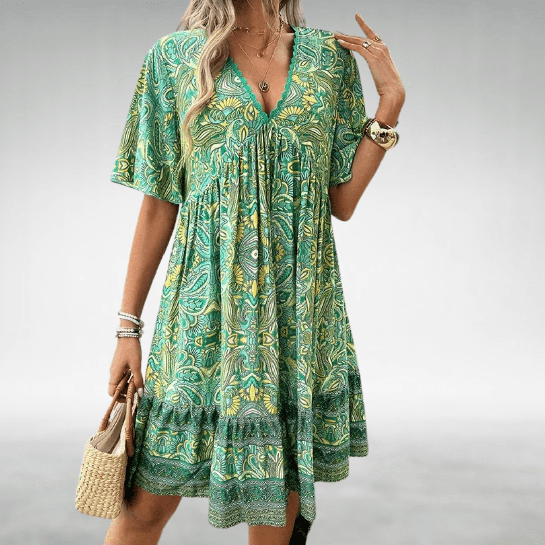 Damen Boho Midikleid mit V-Ausschnitt, Paisley-Muster & elastischem Saum. Ein farbenfrohes Sommerkleid für Freizeit.