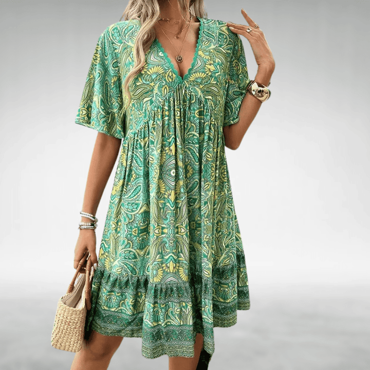 Damen Boho Midikleid mit V-Ausschnitt, Paisley-Muster & elastischem Saum. Ein farbenfrohes Sommerkleid für Freizeit.