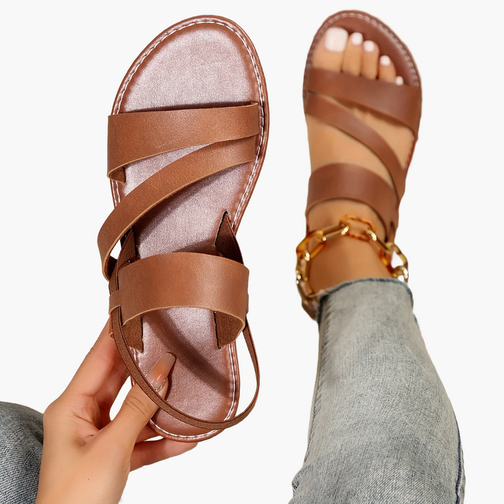 Komfortable Damensandalen mit Kreuzriemen, braun, offene Zehen, für entspannte Sommertage.