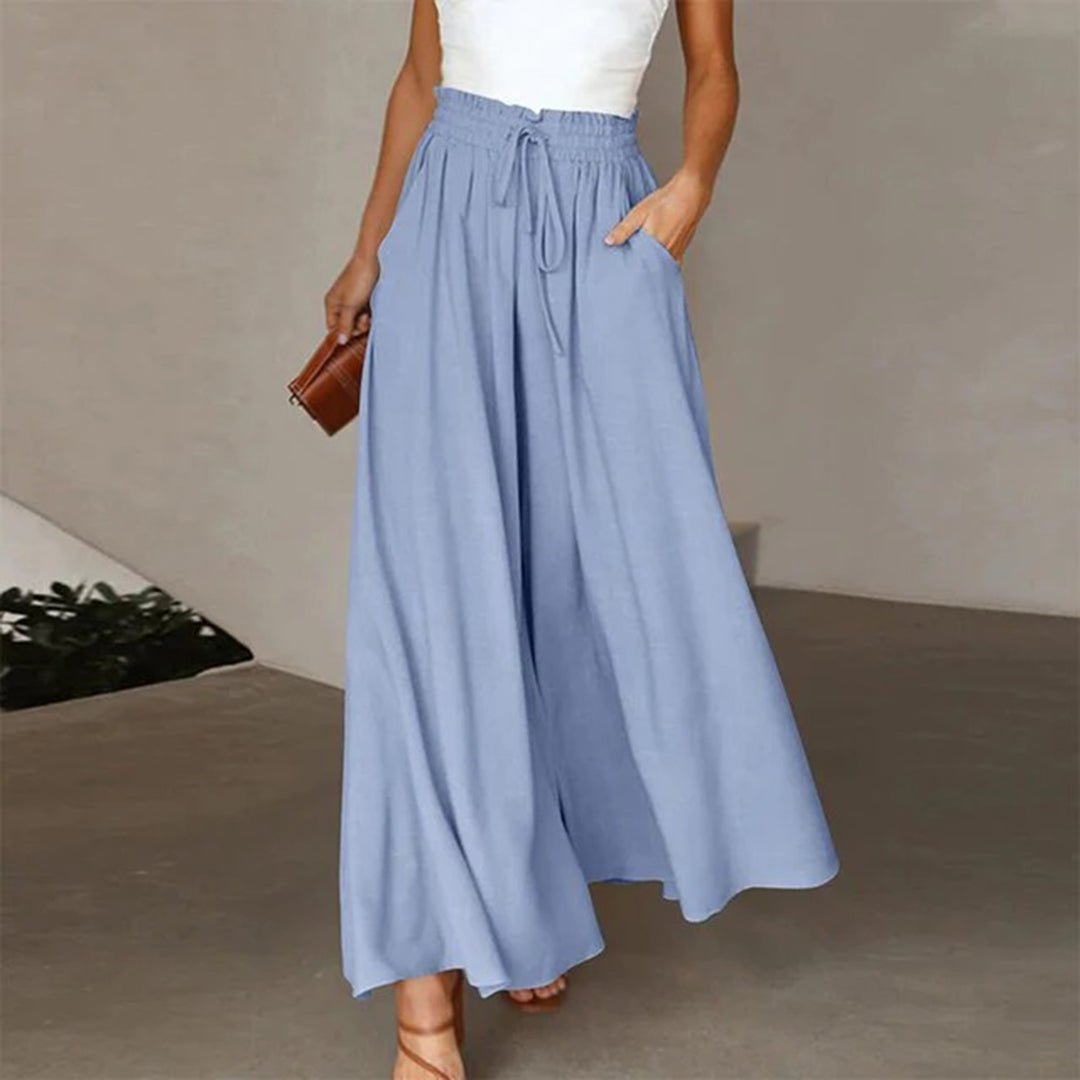 Trendige graue Damenhose mit hohem Bund und weitem Bein, bietet Komfort und eleganten Look.