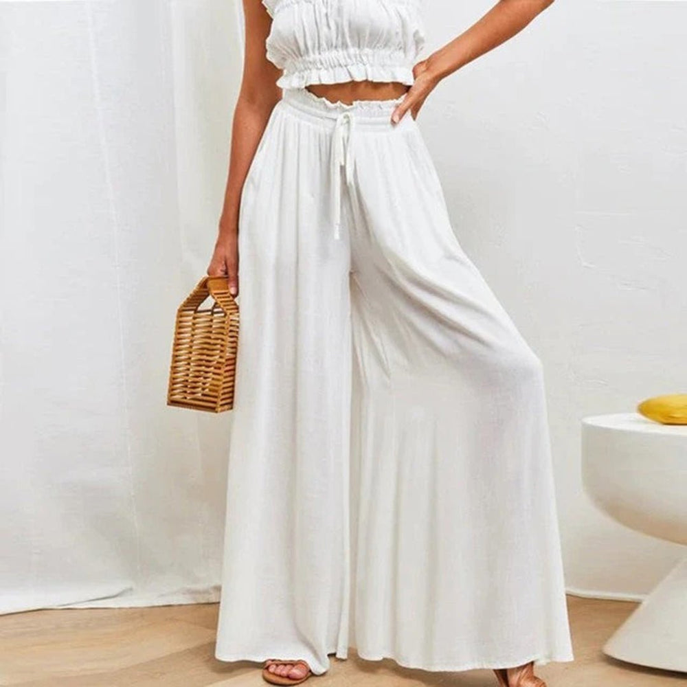 Komfortable, luftige Sommerhose für Damen mit weitem Bein und hohem Bund in Beige. Ideal für Freizeit.