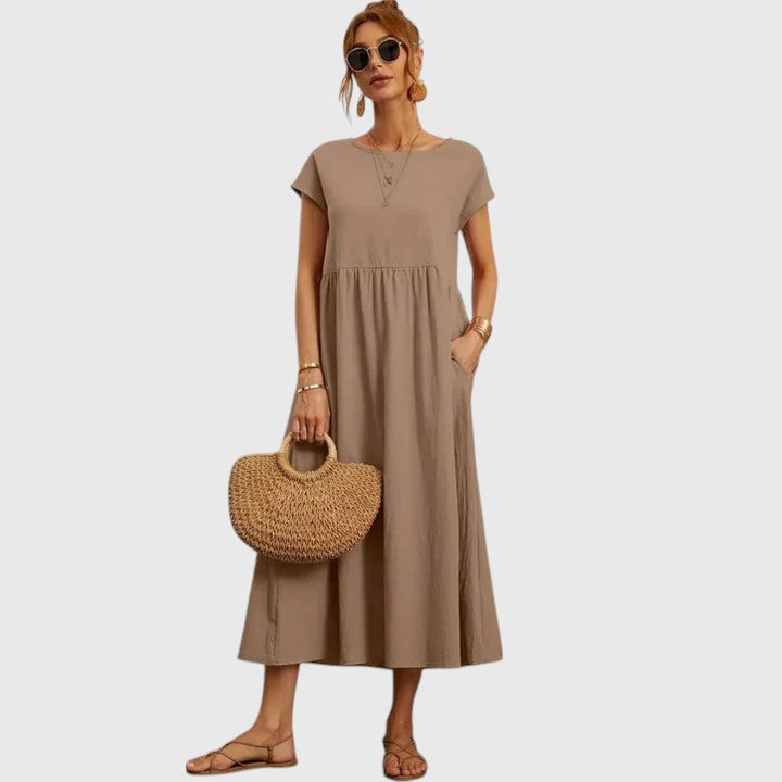 Locker geschnittenes Damen Midikleid mit Kurzarm, Rundhals & Taschen – maximaler Komfort für jeden Tag.