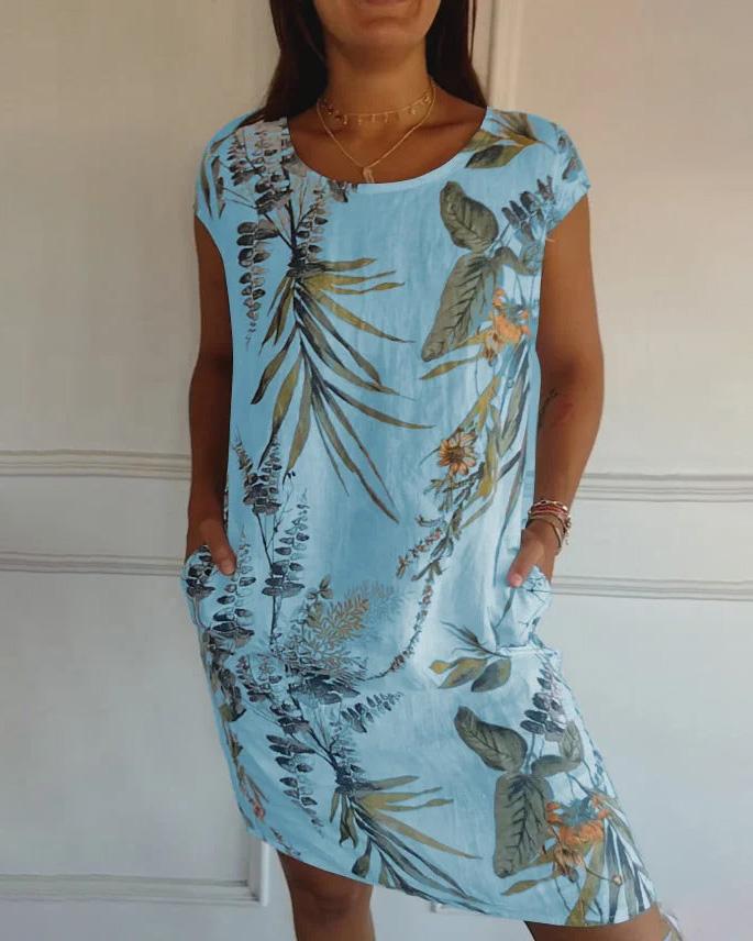 Elegantes, bedrucktes Damen Sommerkleid im tropischen Stil. Rundhalskleid mit bequemer Passform und Taschen.