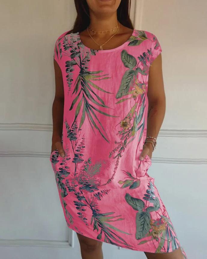 Gemütliches Damen Sommerkleid mit tropischem Design. Rundhals, leichtes Material und praktische Seitentaschen.
