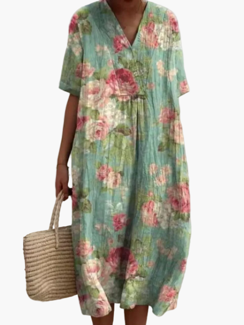 Knielanges Vintage Blumenkleid, locker geschnitten, ideal für heiße Sommertage.