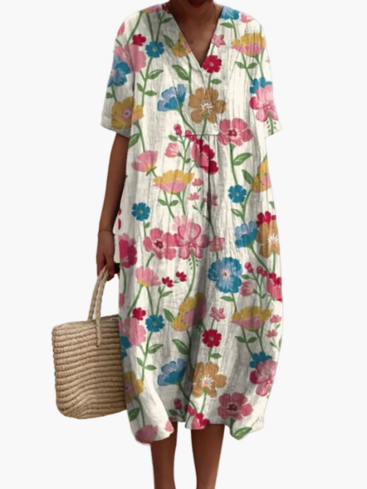 Luftiges Damen Urlaubskleid, Blumenmuster, lockere Passform, ideal für den Sommer.