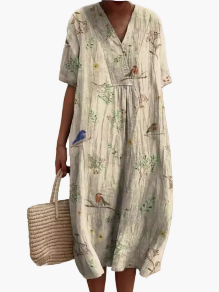 Stilvolles Vintage Sommerkleid mit Kurzarm, Blumenmuster, ideal für den Urlaub.