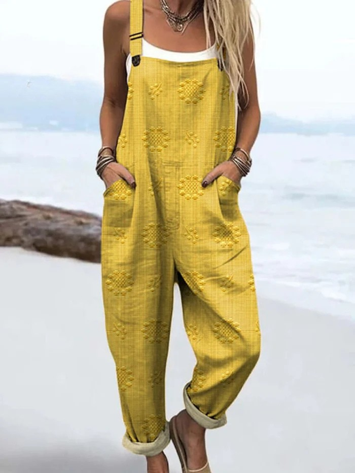 Eleganter Damen Vintage Jumpsuit mit floralem Design. Lässiger Overall für einen modischen Sommer- und Frühlings-Look.