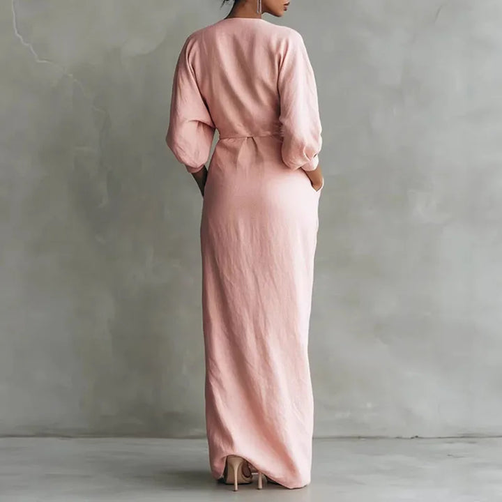 Figurbetontes schwarzes Langarm Wickel Maxikleid für Damen mit elegantem V-Ausschnitt. Fließendes Abendkleid.