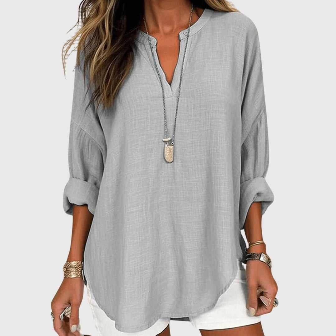 Atmungsaktive Damen V-Ausschnitt Bluse, locker fallend, ideal für heiße Sommertage.