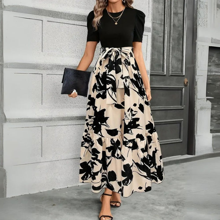 Elegantes Damen Maxikleid für den Sommer mit floralem Muster, hoher Taille und A-Linien-Schnitt. Ideal als Urlaubskleid.