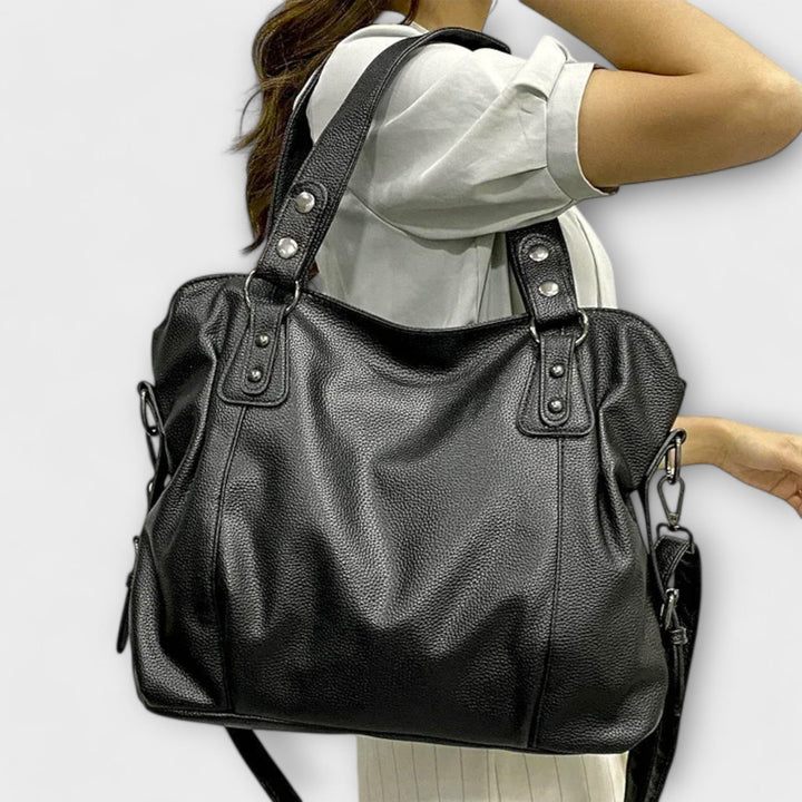 Braune Damen Handtasche im Hobo-Stil, ideal als modisches Accessoire und Umhängetasche.