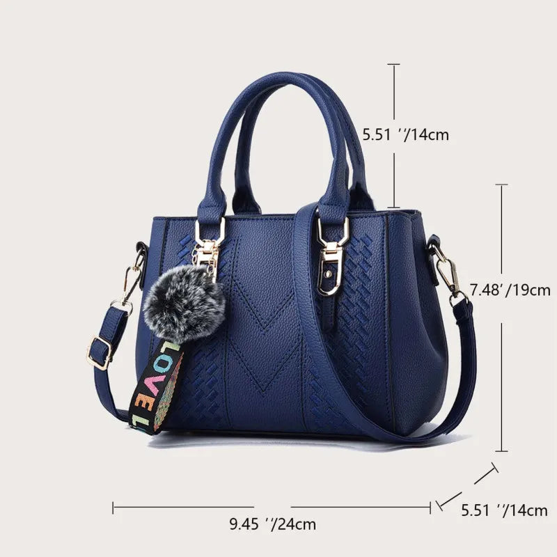 Elegante Damen Lederhandtasche mit Pompon in verschiedenen Farben. Hochwertiges Accessoire für den Alltag.