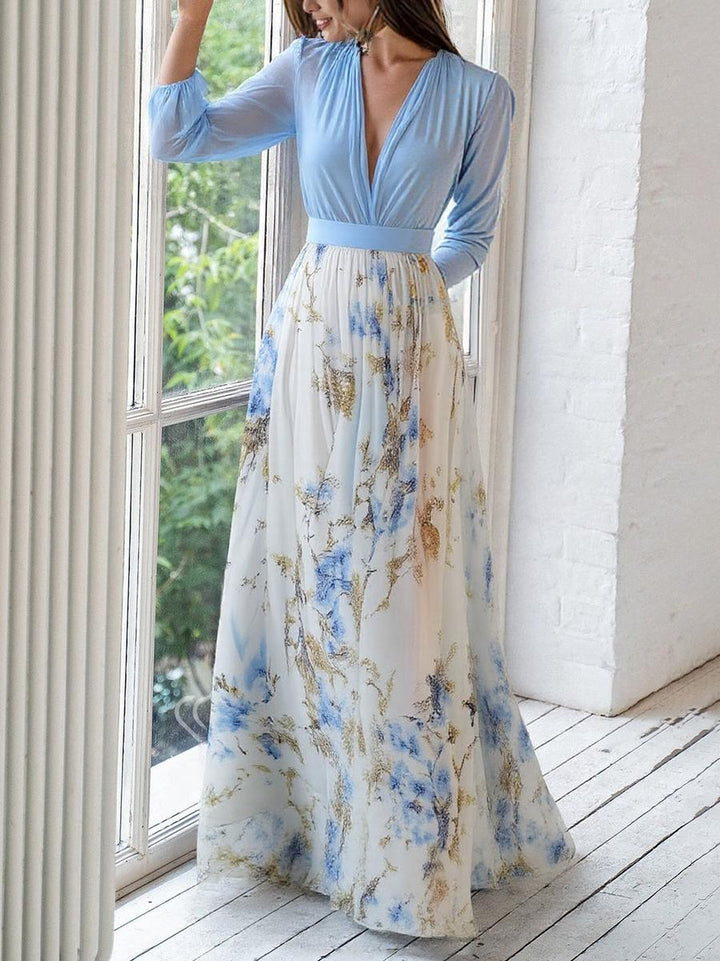 Festliches blaues Maxikleid für Damen, mit elegantem Blumenmuster, Langarm und modischem V-Ausschnitt. Ideal für Herbst.
