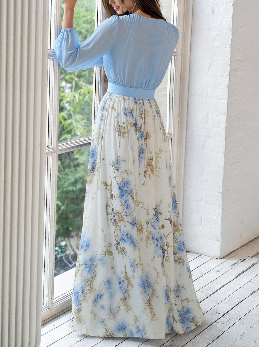 Schickes Damen Herbstkleid in Blau mit Blumenmuster. Ein elegantes Langarm Maxikleid für festliche Anlässe und Hochzeiten.