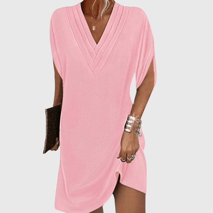 Schickes Damen Abendkleid in Midi-Länge, mit V-Ausschnitt und lockerem Schnitt. Für elegante Anlässe.