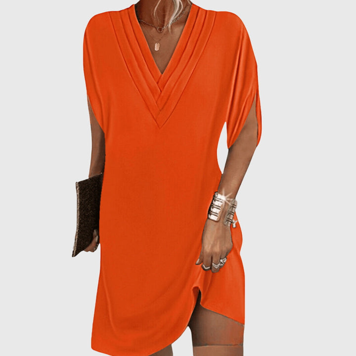 Vielseitiges Damen Midi Kleid mit V-Ausschnitt, elegant und locker zugleich. Ideal für Urlaub und Alltag.