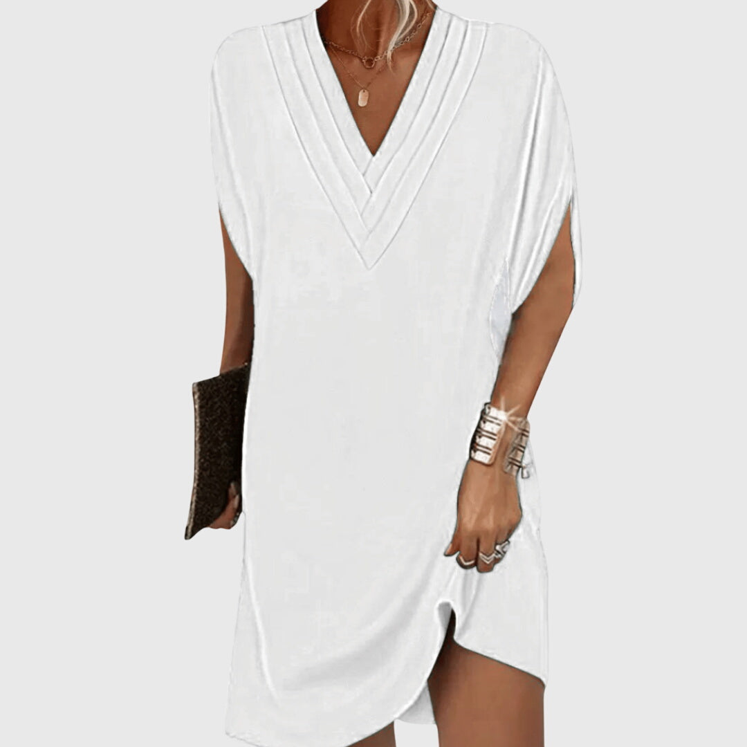 Damen Midi Freizeitkleid mit elegantem V-Ausschnitt und kurzen Ärmeln. Lockerer Schnitt für hohen Tragekomfort.