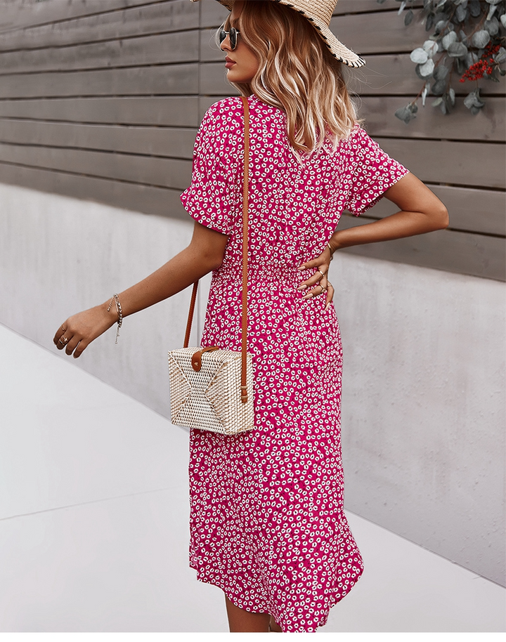 Stylisches Damen Sommerkleid mit V-Ausschnitt, floralem Design und Kurzarm, für elegante Anlässe.