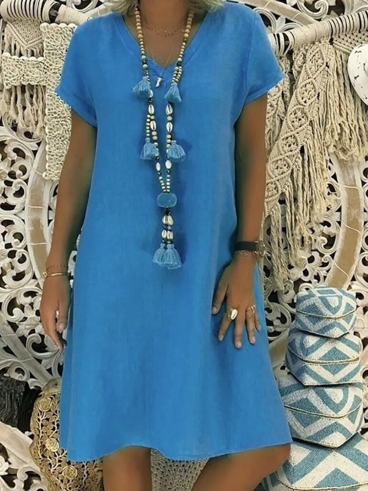 Elegantes Damen Minikleid mit V-Ausschnitt, Kurzarm. Sommerliche A-Linien-Kleid für Freizeit.