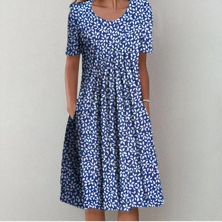 Fließendes Damen Sommerkleid mit Punkten, pflegeleichtes elegantes Midikleid, ideal für festliche Events.