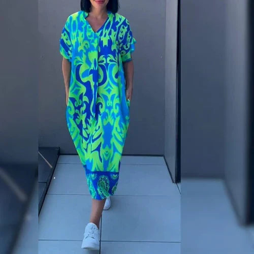 Elegantes Damen Wickelkleid in Azurblau mit floralem Blumenmuster, ideal für Sommer & Freizeit.