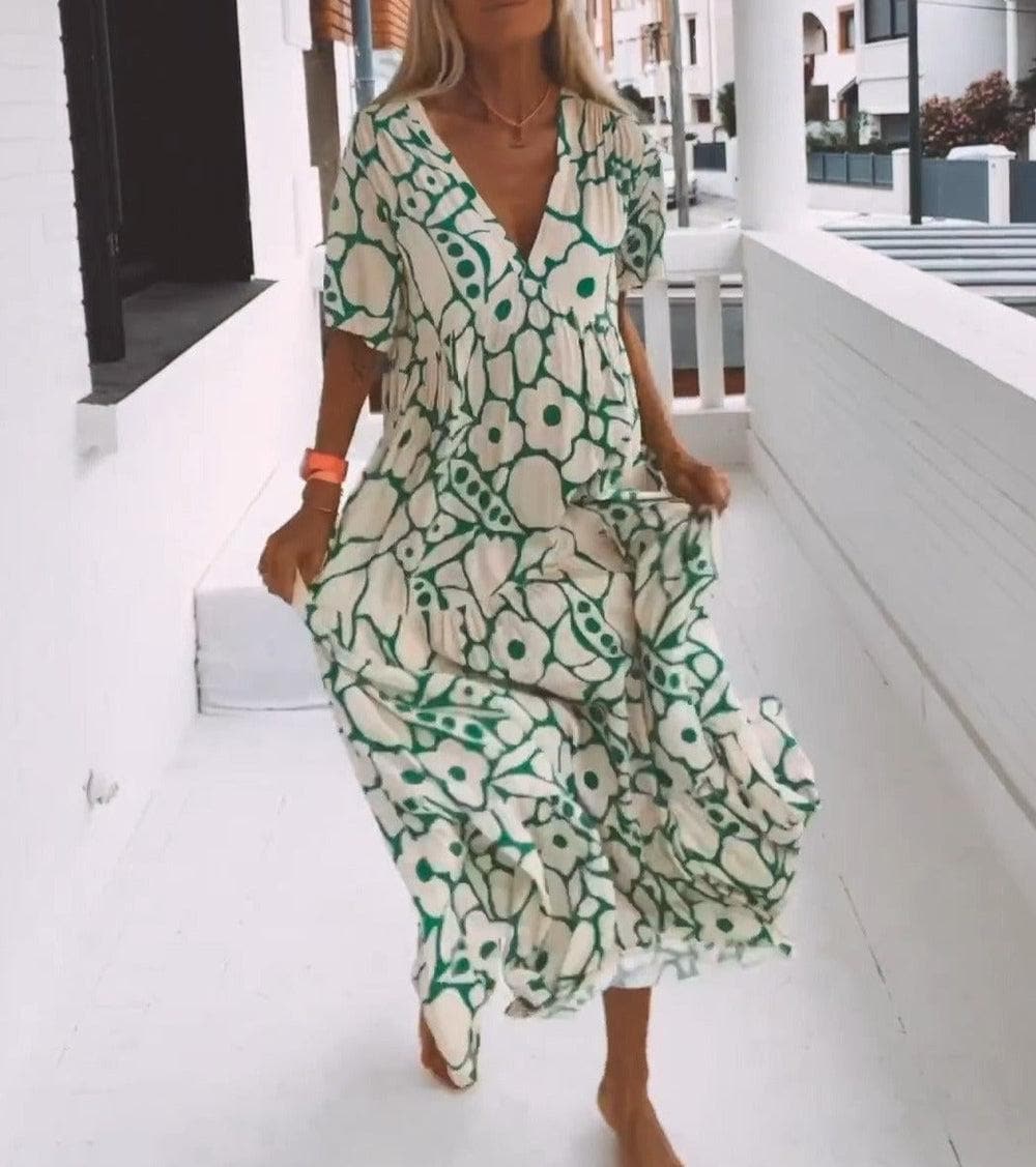 Schickes Damen Sommerkleid, geblümt, mit V-Ausschnitt & Flügelärmeln. Fließendes Boho Maxikleid für Eleganz & Komfort.