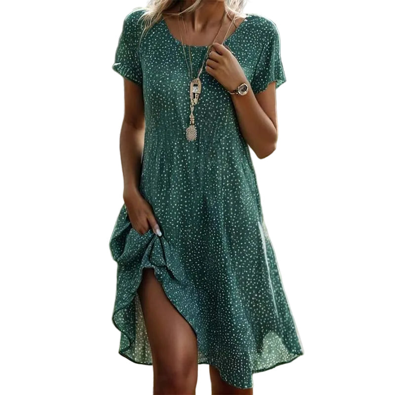 Feminin grünes Midi-Sommerkleid für Damen mit elegantem Blumenmuster, ideal für warme Tage und Freizeit.