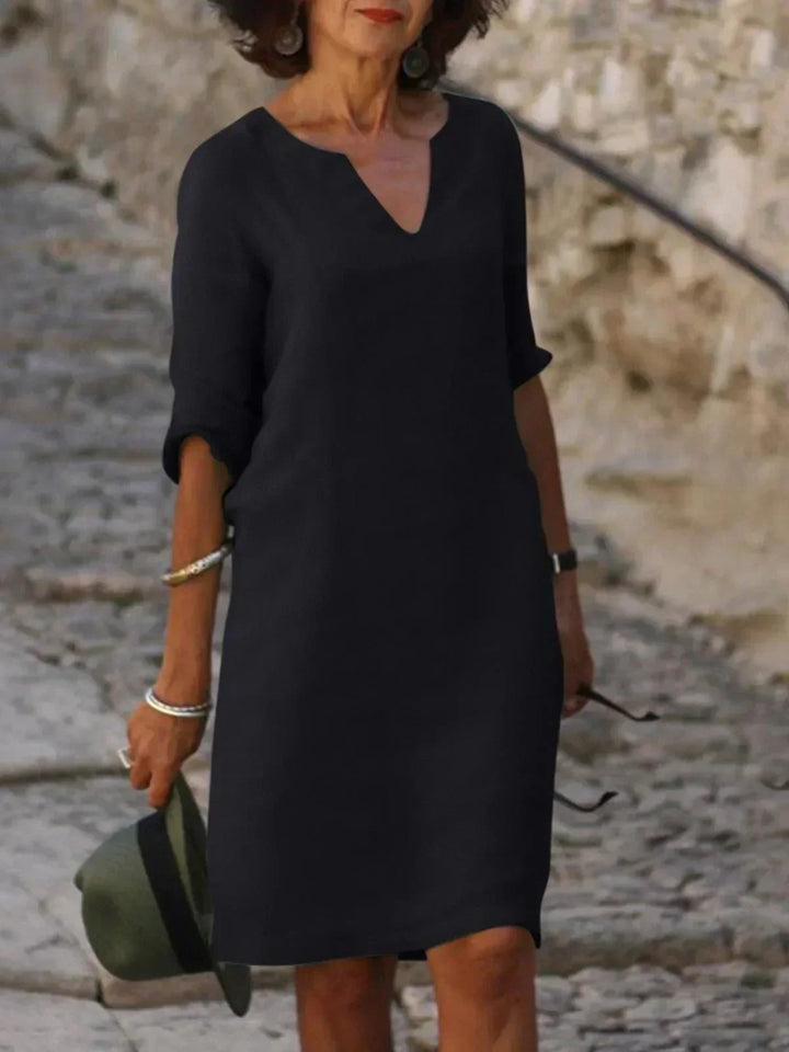Elegantes schwarzes Damen Midikleid mit V-Ausschnitt, perfekt für Freizeit & Sommer.