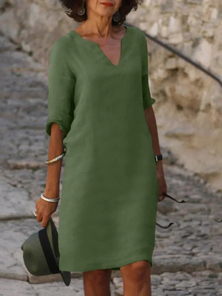 Olivgrünes Damen Midikleid mit elegantem V-Ausschnitt, vielseitig für Sommer & Anlässe.