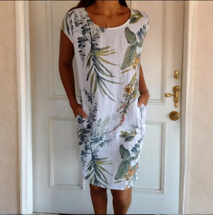 Damen Sommerkleid mit botanischem Print, Rundhals und praktischen Taschen, ideal für Frühling & Sommer.